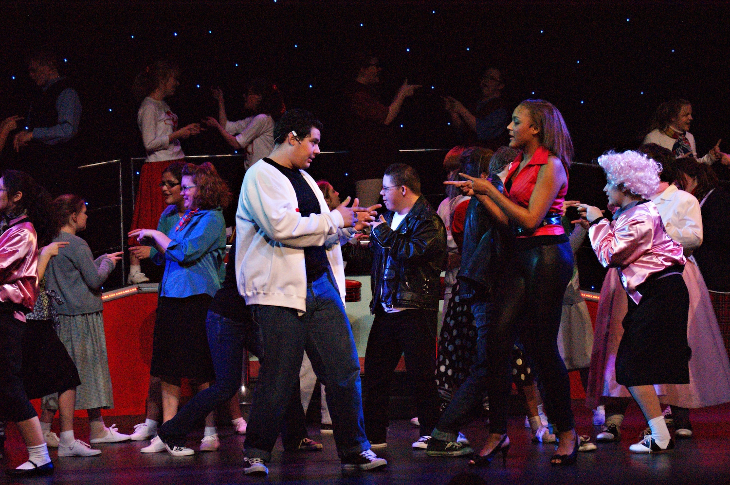 Children performing on stage.